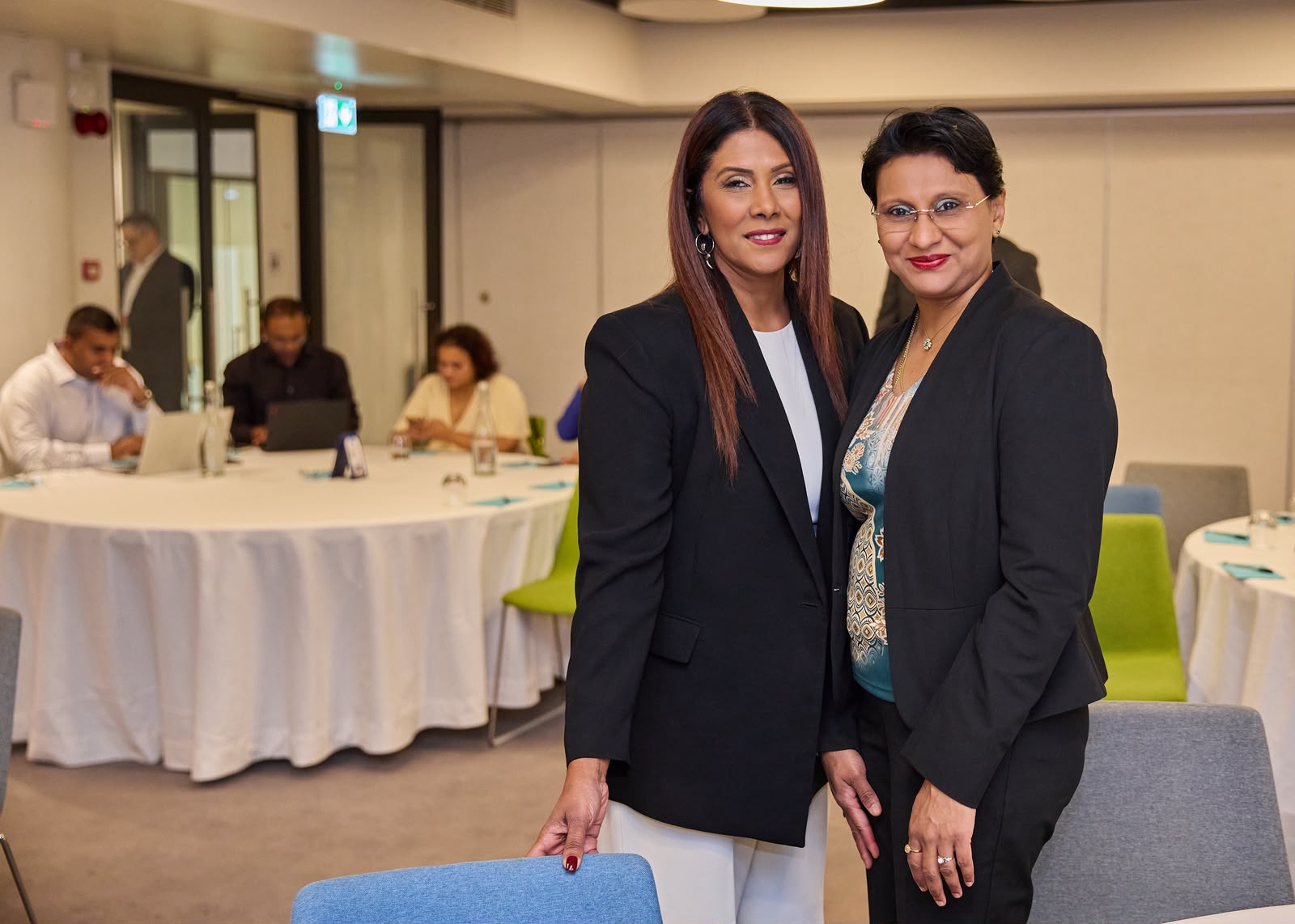 Kevina Takoordyal with a guest at the corporate event